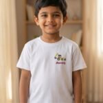 Boy wearing white tshirt with excavator pocket design embroidery and custom name