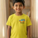 Boy wearing a yellow t-shirt with small SUV embroidery and custom name Arjun on the left chest